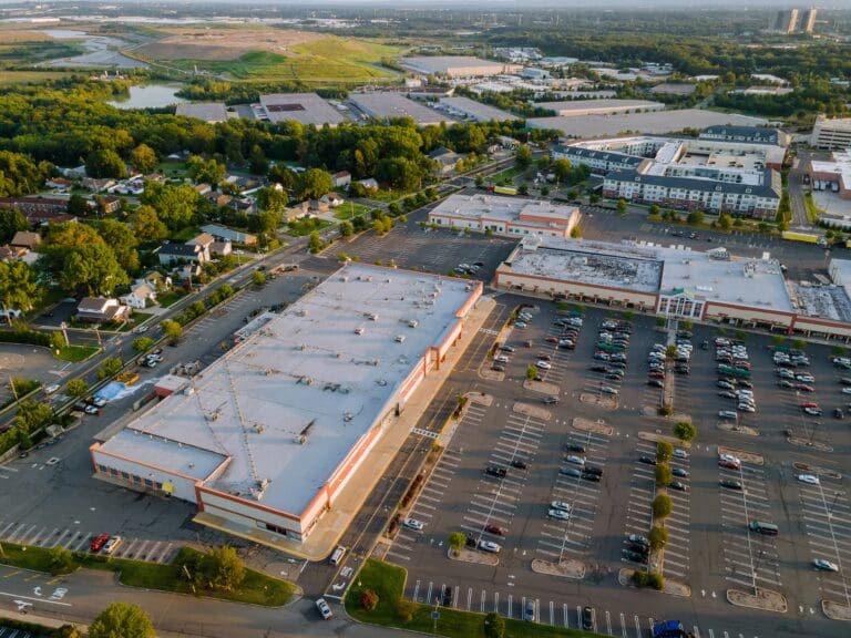 Aerial view shopping mall of goods exterior view with of parking lot space