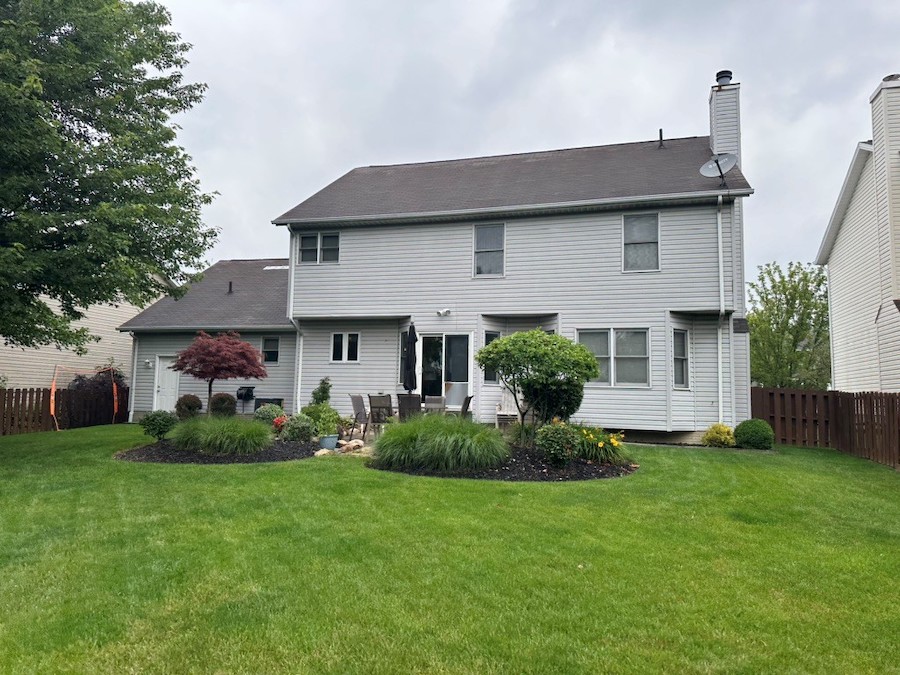 Asphalt roof on white home