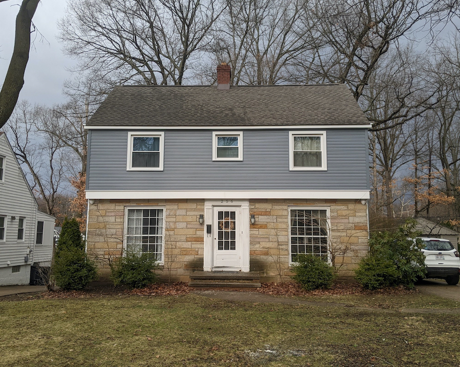 Asphalt shingles on a two-story home. 