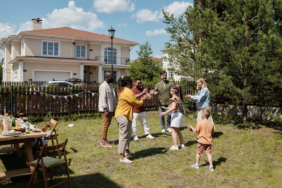 Adults and Child Playing Outdoor Game in Backyard
