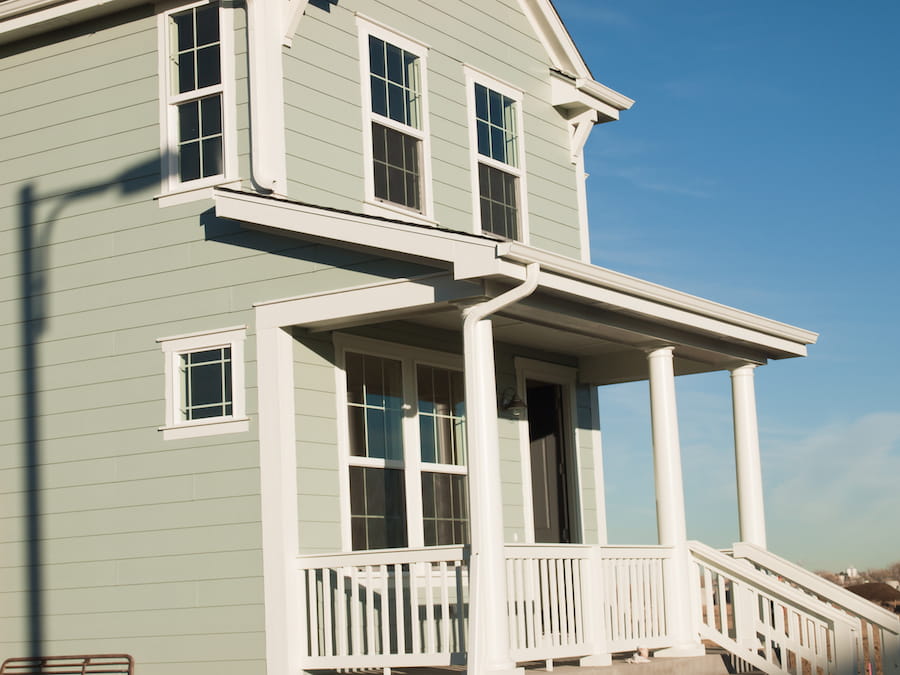 Home Exterior with Blue Sky and White Trim
