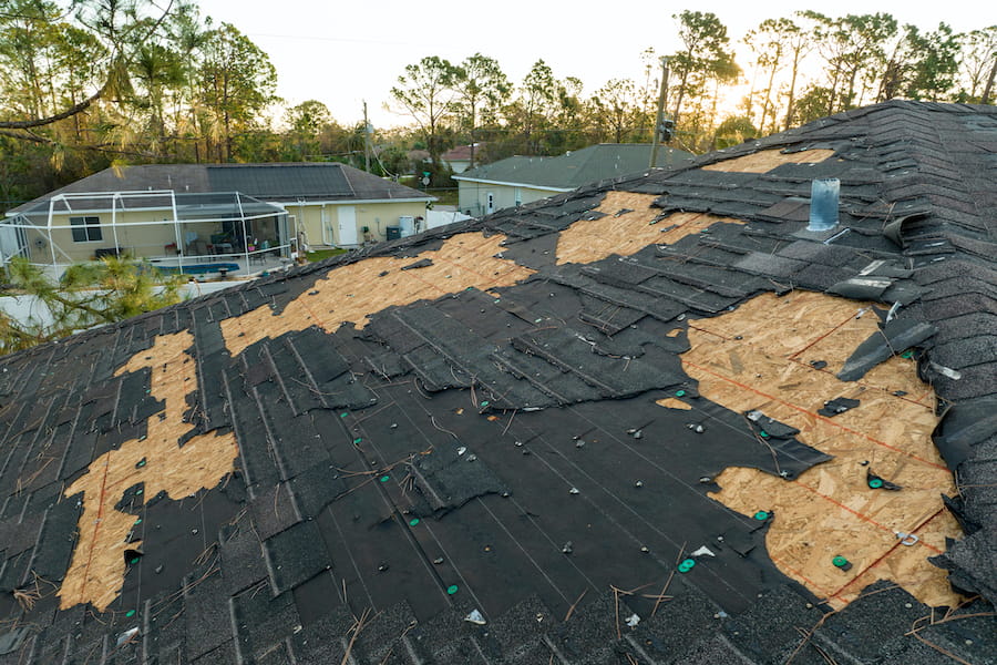 Missing shingles exposing roof underlayment after storm damage