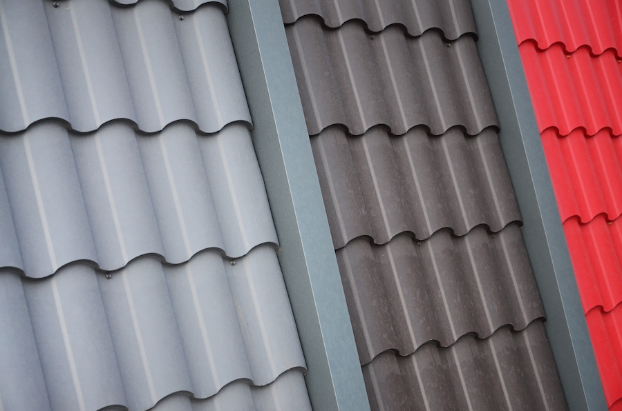 Residential home with standing seam metal roofing installed on a modern roof design