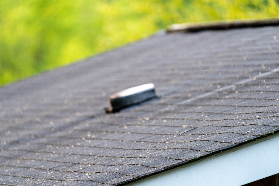 Well-maintained asphalt shingle roof protecting a residential home