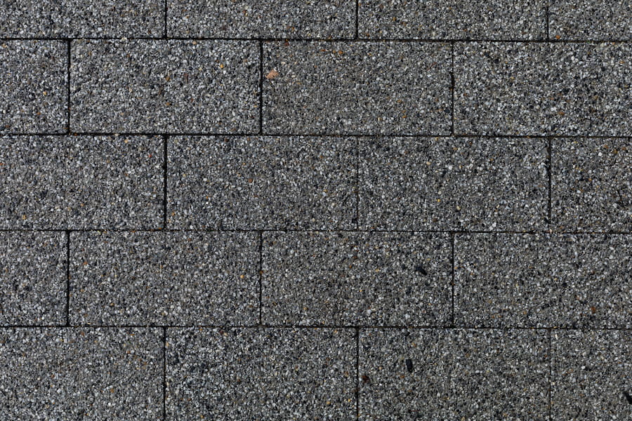 Rough Textured Surface Of Paving Slabs In An Urban Environment. Background Close Up